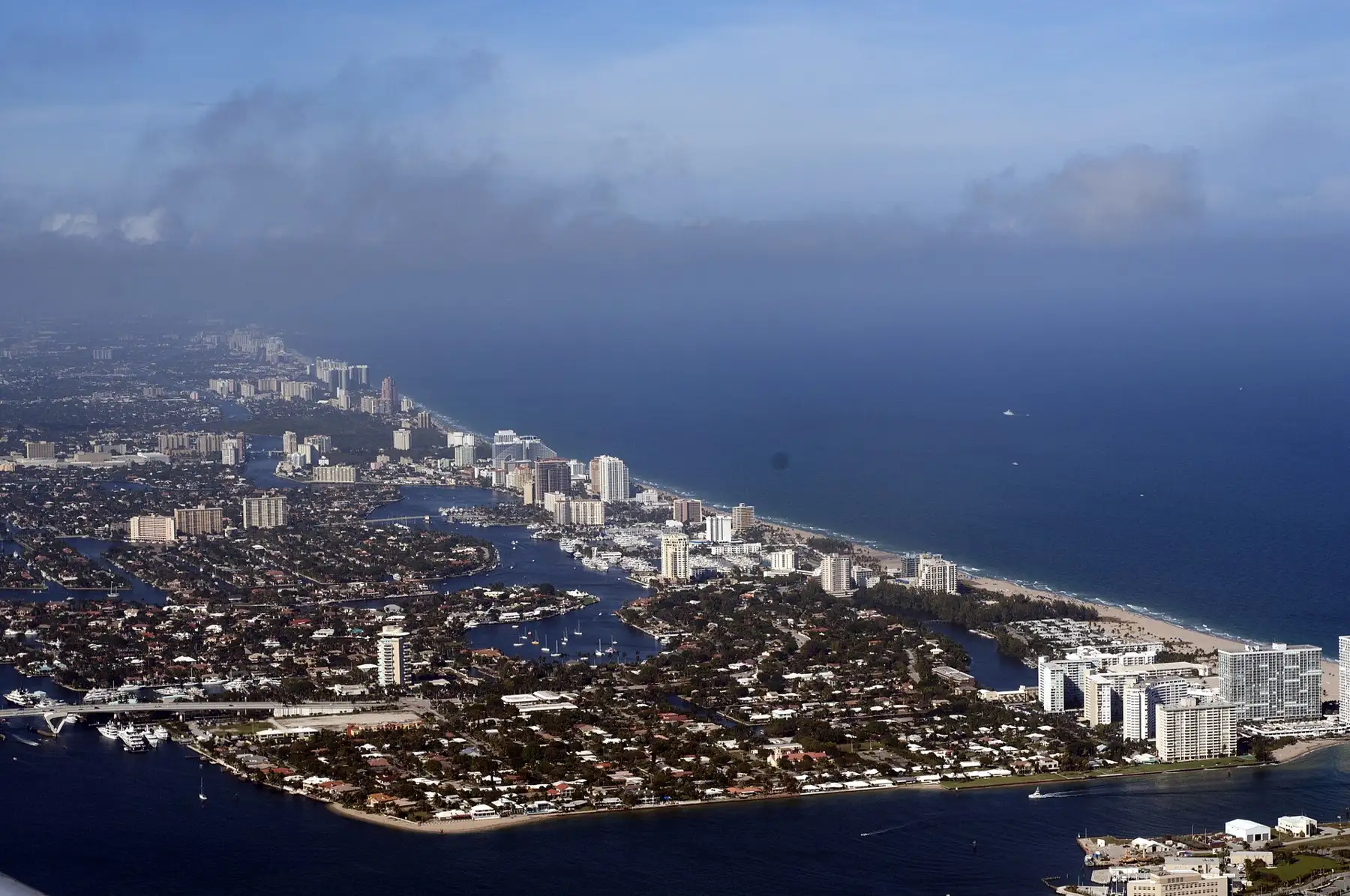 The Intracoastal and the beach strip running north toward the Galt, seen from over Port Everglades — Coral Ridge Towers, Fort Lauderdale
