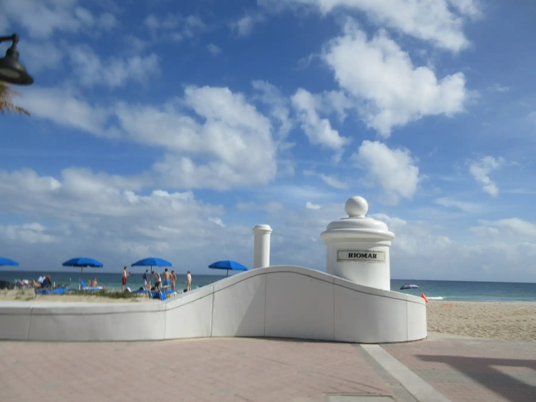 The white wave wall and beach umbrellas on Fort Lauderdale Beach off A1A
