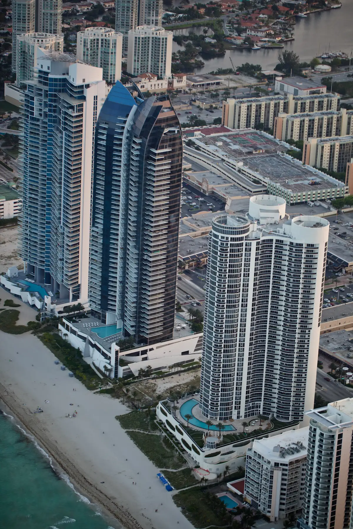 Ocean Four, the rounded white tower in front, with Jade Ocean and Jade Beach behind it, seen from the air