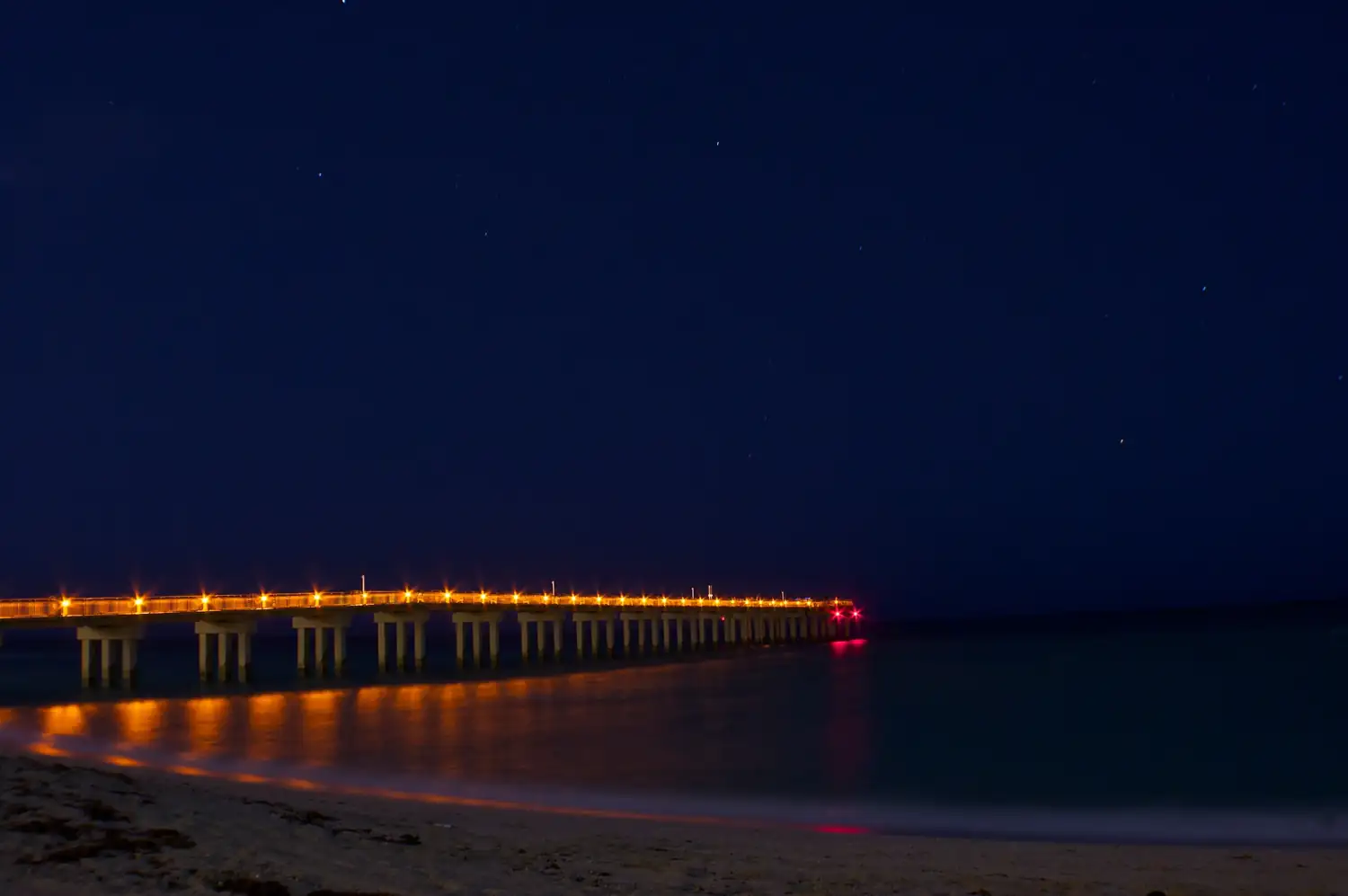 The pier lit up at night — near Ocean Reserve, Sunny Isles Beach
