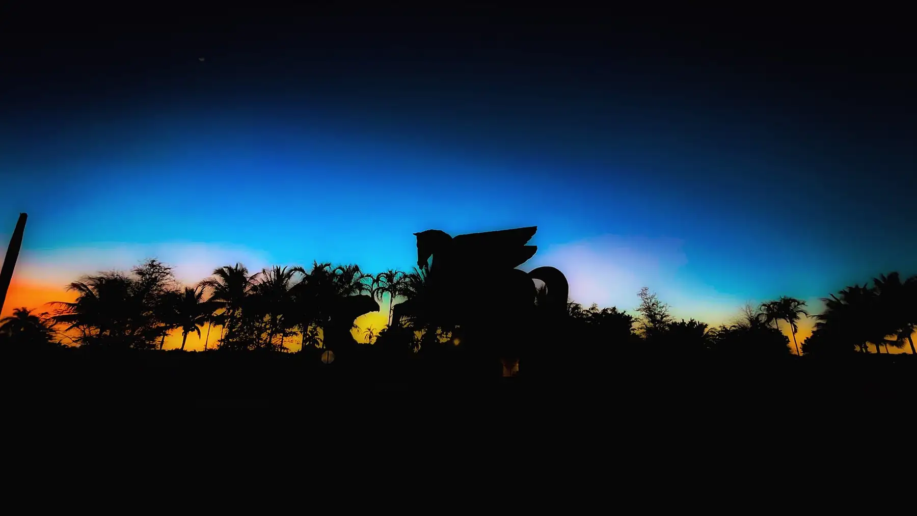 The Pegasus and Dragon statue at Gulfstream Park at sunset — Parker Tower, Hallandale Beach