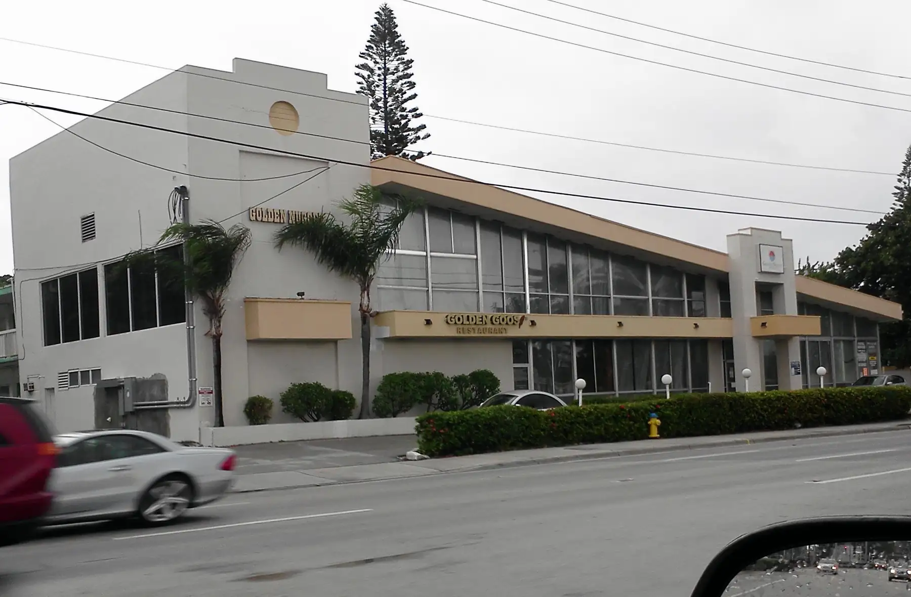 18555 Collins Avenue in 2011, before construction: the site was home to low-rise restaurants — Porsche Design Tower, Sunny Isles Beach