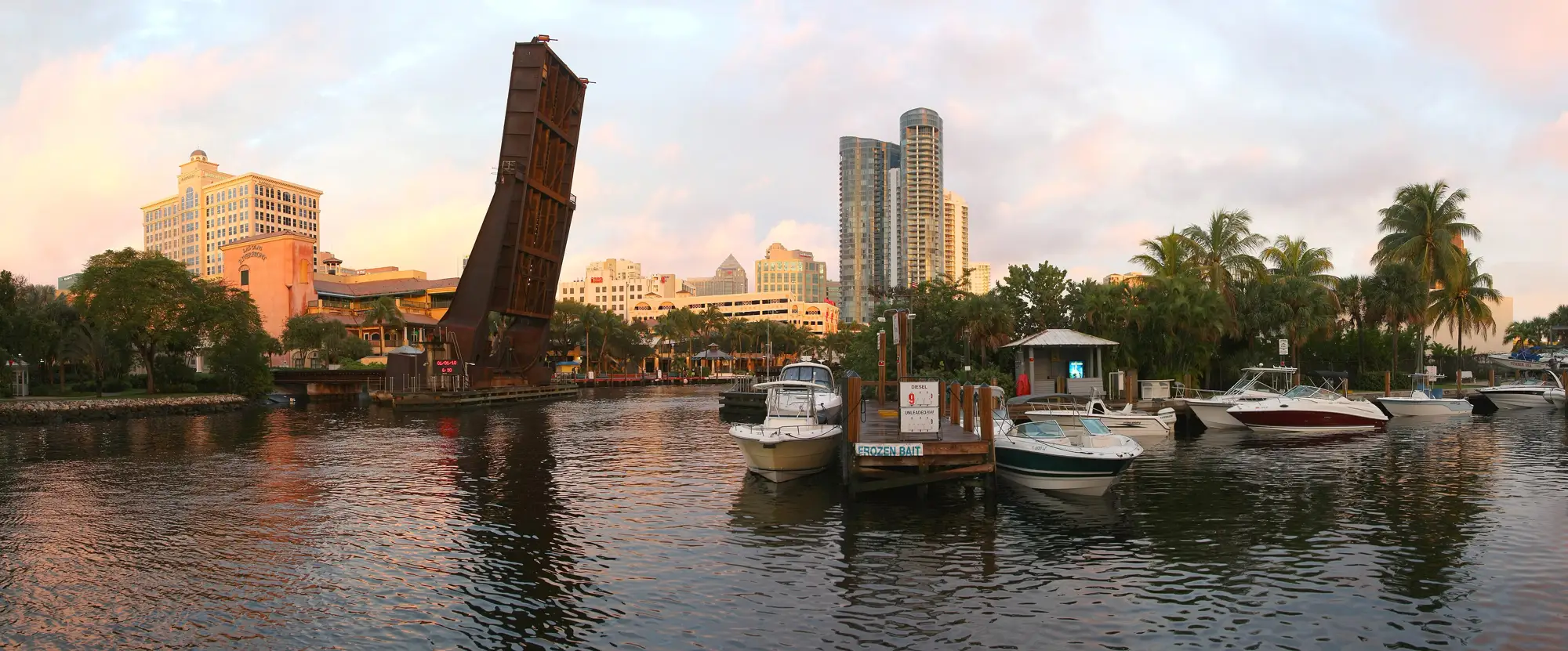 The New River at sunset; River House’s twin glass towers at center — Las Olas River House, Fort Lauderdale