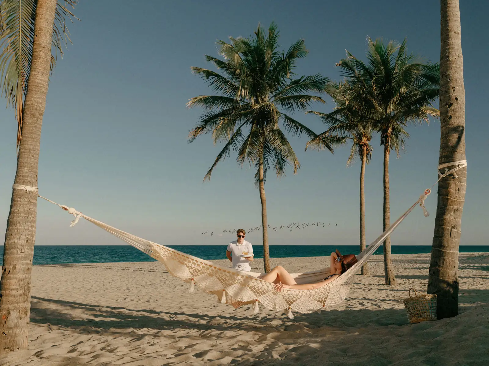 Beach hammock under palms on Fort Lauderdale Beach, St. Regis Bahia Mar lifestyle