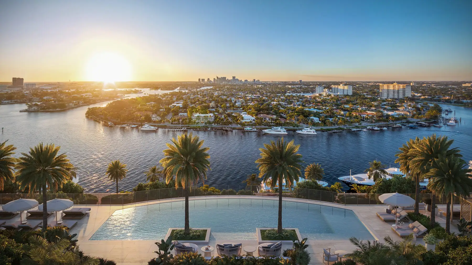 Resort Collection pool deck at sunset over the Intracoastal Waterway at St. Regis Bahia Mar