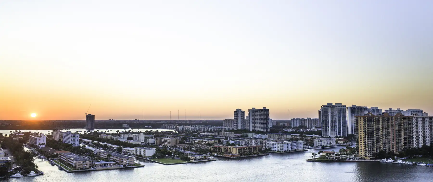 The bay side of Sunny Isles at sunset, looking west from Collins Avenue, 2015 — Winston Towers 500, Sunny Isles Beach